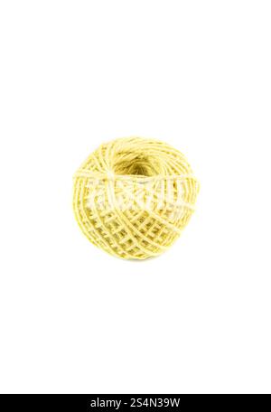A roll of yellow jute twine placed on a white background, ideal for crafting, packaging, and DIY projects. Perfect for online stores or product catalo Stock Photo