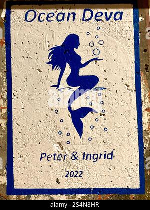 ‘Good Luck’ painting on the wall of Madeira Harbour, Portugal. Stock Photo