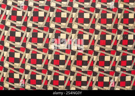 A red, beige and black chequered fabric in a close up view Stock Photo