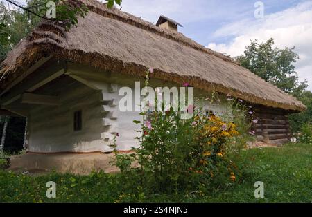 Small Ukrainian historical house (preceding century, museum of Ukrainian folk architecture in Pirogovo village (near Kiev)) Stock Photo