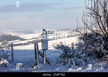 A snow covered Sussex landscape with a blue sky overhead Stock Photo ...