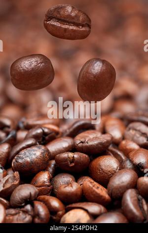 Many roasted coffee beans falling on pale light blue background Stock ...