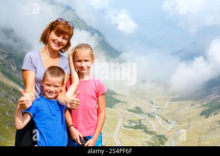 Family in summer mountain. View from Transfagarasan road (Romania) Stock Photo