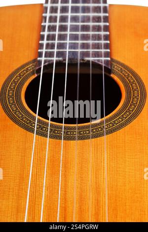 body of classical acoustic guitar with six nylon strings close up Stock Photo