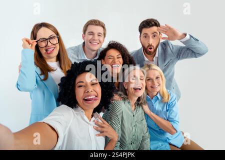 Diverse group of professionals enjoying a friendly moment together in a team environment Stock Photo
