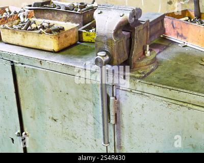 vice and details on workbench in locksmith shop Stock Photo - Alamy