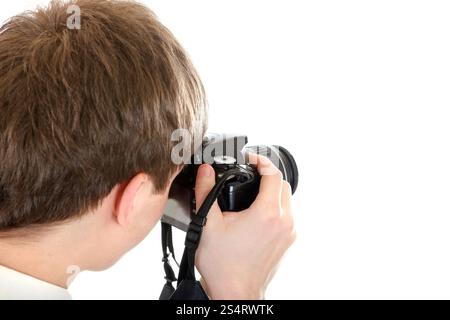 Rear view of the Person Take a Picture with a Camera Isolated on the White Background Stock Photo