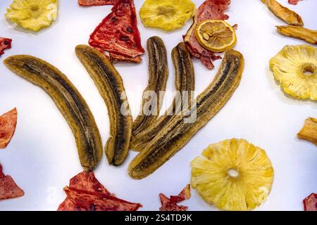 Dry dried sliced ​​fruits in the form of chips isolated on white background, top view. Stock Photo