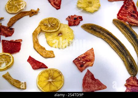 Dry dried sliced ​​fruits in the form of chips isolated on white background, top view. Stock Photo