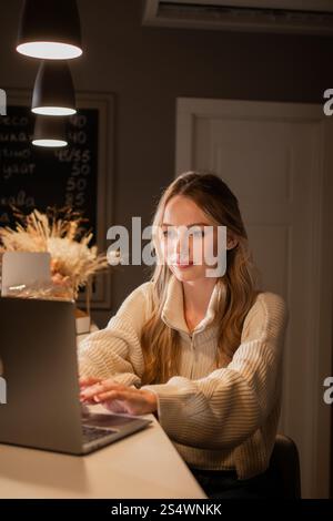 Woman in coffee shop small business owner, entrepreneur in cafeteria. Happy female businesswoman working on cafe franchise Stock Photo