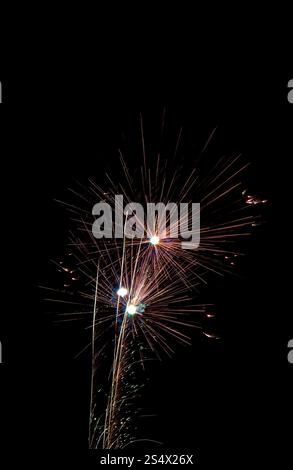 Fireworks exploding in the night sky Stock Photo