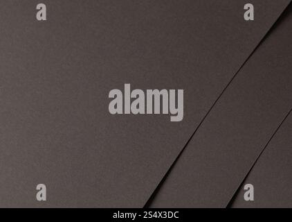 Charcoal gray paper background with a matte finish and minimalistic overlapping layers. Smooth, clean, and refined, it creates a stylish, versatile, a Stock Photo