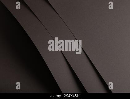 Charcoal gray paper background with matte, overlapping layers and subtle shadows. The textured gradient design creates a bold, refined, and versatile Stock Photo
