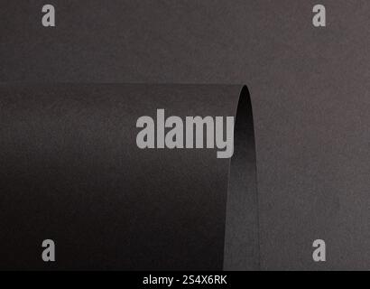 Jet black paper background with a matte, grainy texture and subtle gradient. Dark tones create a bold, refined, and luxurious design with a seamless, Stock Photo