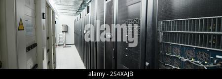 Rows of server racks highlight advanced computer systems supporting cloud services, banner Stock Photo