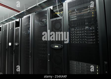 Advanced server room with high-tech hardware supporting cloud computing activities. Stock Photo
