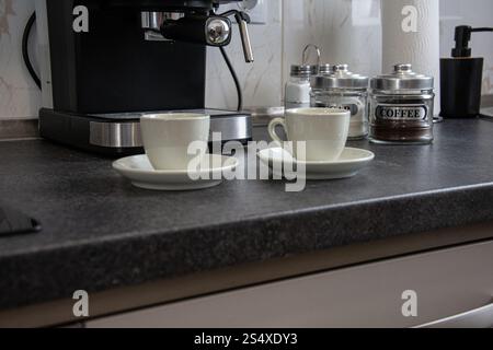 Cup of coffee in coffe machine Stock Photo