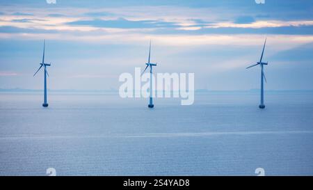 Travel to Denmark - turbines of offshore wind farm Middelgrunden in Oresund near Copenhagen city in Baltic Sea in blue autumn morning Stock Photo