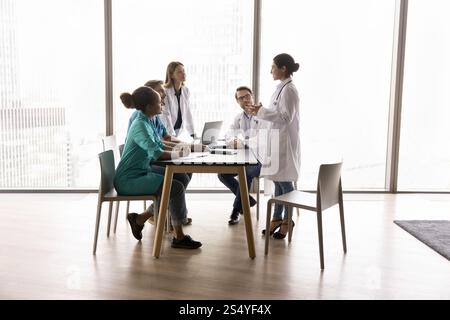 Young Indian female doctor performs, make speech during concilium Stock Photo