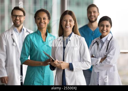 Group of healthcare professionals, doctors and nurses posing for camera Stock Photo