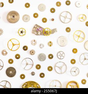 watchmaker workshop - pattern from various old watch spare parts on white background Stock Photo