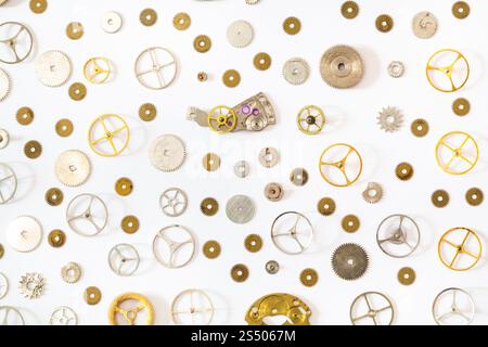 watchmaker workshop - ornament from various old watch spare parts on white background Stock Photo