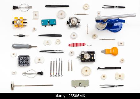 watchmaker workshop - ornament from various watch repairing instruments on white background Stock Photo