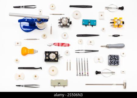 watchmaker workshop - pattern from various watch repairing tools on white background Stock Photo