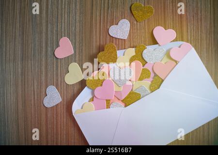 Valentines day love letter. opened envelope and many felt hearts. Empty copy space Stock Photo