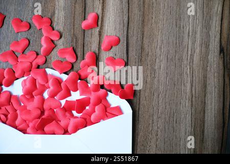 Valentines day love letter. opened envelope and many felt hearts. Empty copy space Stock Photo