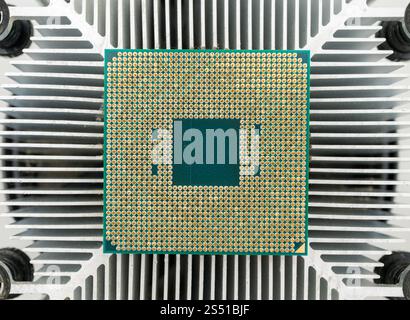 Pin side of a CPU processor mounted on a cooler Stock Photo