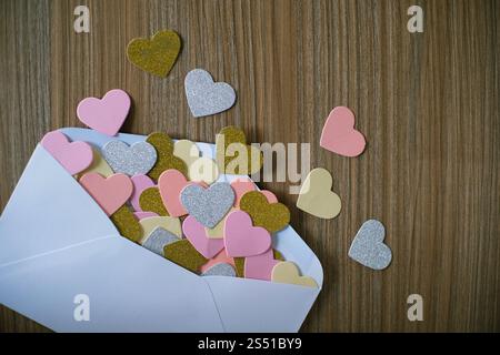 Valentines day love letter. opened envelope and many felt hearts. Empty copy space Stock Photo