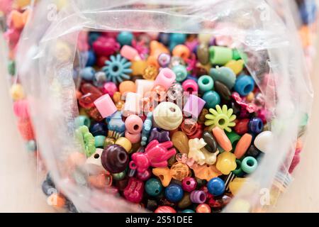 Bag full of colorful plastic beads Stock Photo