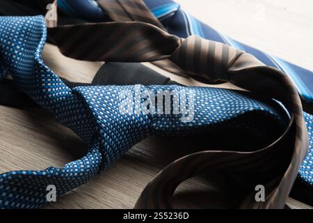 Silk neck ties on wooden background. Stock Photo