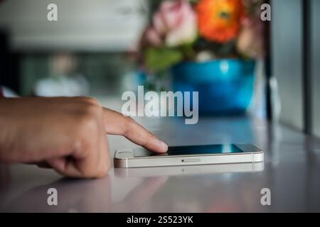 Close up of Womans hands holding cell phone with blank copy spa. Close up of Womans hands holding cell phone with blank copy space screen. Stock Photo