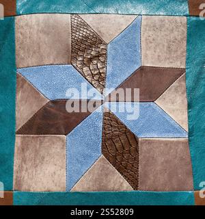 stitched star pattern from leather pieces on decorative pillow Stock Photo