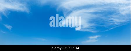 White cirrus fuzzy clouds in the blue azure sky. Summer good weather background. Stock Photo