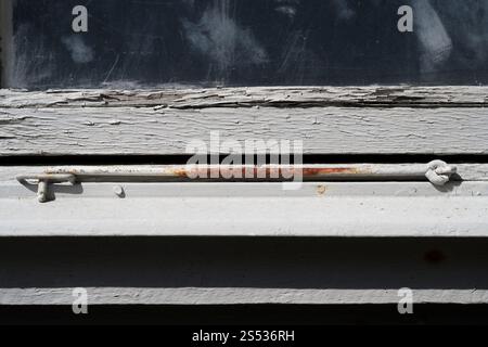 Part of a window and an old building in bad shape Stock Photo