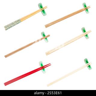 collection from various wooden chopsticks served on chopstick rest isolated on white background Stock Photo