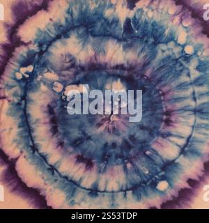 textile background - abstract blue and purple concentric circles hand-painted on silk in tie-dye batik technique Stock Photo