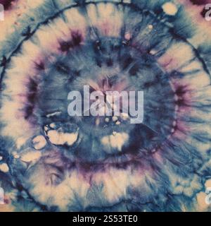 textile background - abstract blue and purple concentric circles hand-painted on silk in tie-dye batik technique Stock Photo