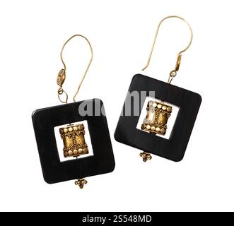 handmade earrings from traditional indian brass items and horn frame isolated on white background Stock Photo