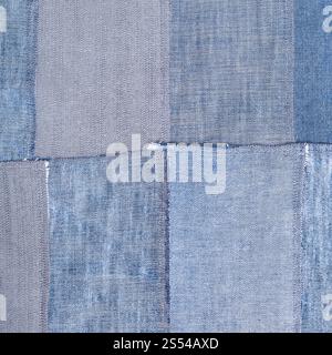 textile square background - patchwork from old denim flaps. patchwork from old denim flaps Stock Photo