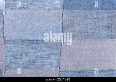 textile background - patchwork from denim flaps. patchwork from denim flaps Stock Photo