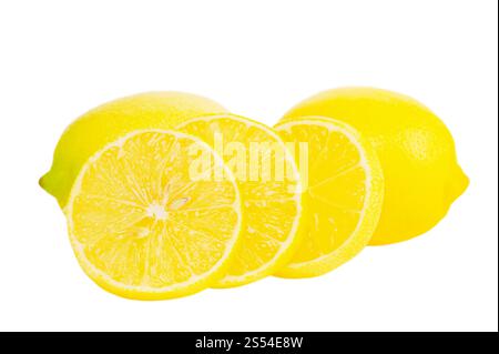Lemon slices and two whole lemons isolated on white. Citrus, lemon Stock Photo