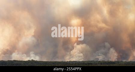 Bushfire smoke filled sky in the distance in Australia. environmental disaster background. Stock Photo