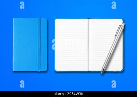 Cyan closed and open lined notebooks with a pen isolated on blue background. Cyan closed and open notebooks with a pen isolated on blue background Stock Photo