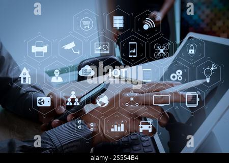 Internet of Things (IOT) technology with AR (Augmented Reality) on VR dashboard. two colleague web designer discussing data and digital tablet Stock Photo