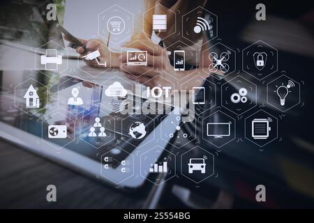 Internet of Things (IOT) technology with AR (Augmented Reality) on VR dashboard. designer hand working with digital tablet and laptop computer and Stock Photo