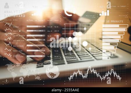 Intelligence (BI) and business analytics (BA) with key performance indicators (KPI) dashboard concept.close up of hands using laptop and holding Stock Photo